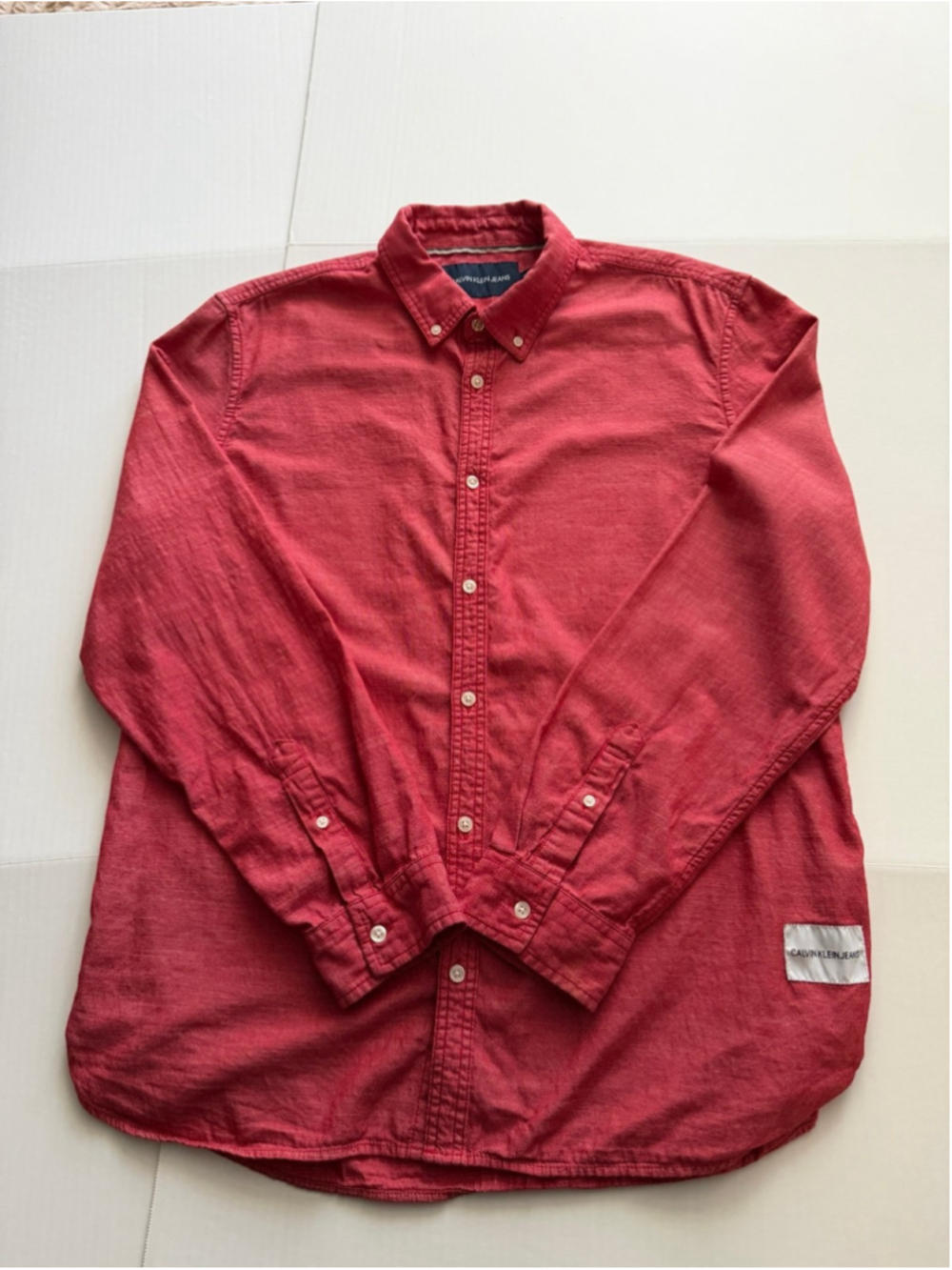 Calvin Klein red long-sleeve button-down shirt with CK patch on bottom sz XL